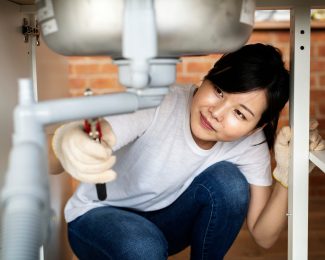 Asian,Woman,Fixing,Kitchen,Sink